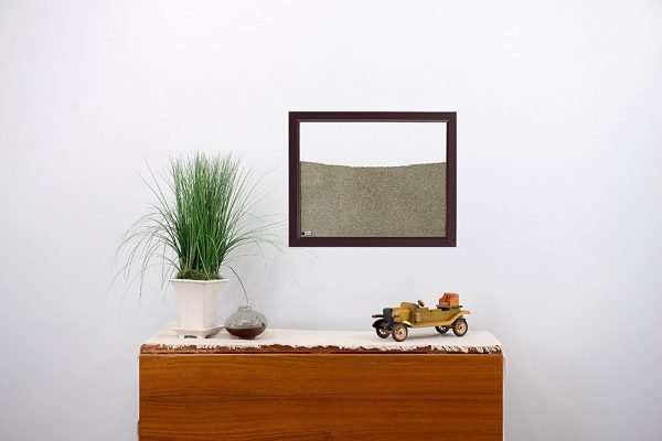 brown painted wood frame ant farm hanging on wall