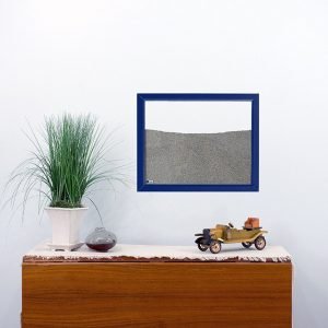 navy painted wood frame ant farm hanging on wall